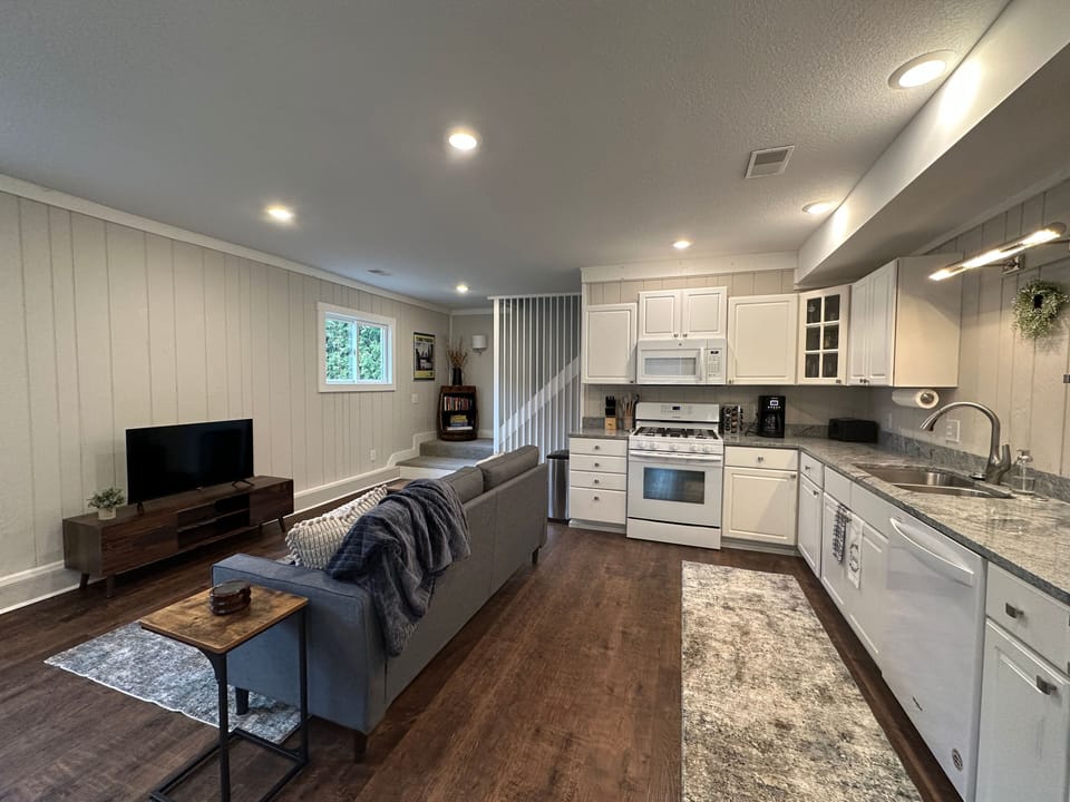 Main living area with well stocked kitchen.