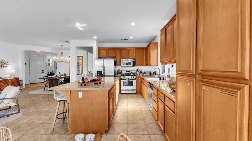 Beautiful oversized kitchen with granite counters and bar seating—ideal for entertaining guests or cooking your favorite dishes.