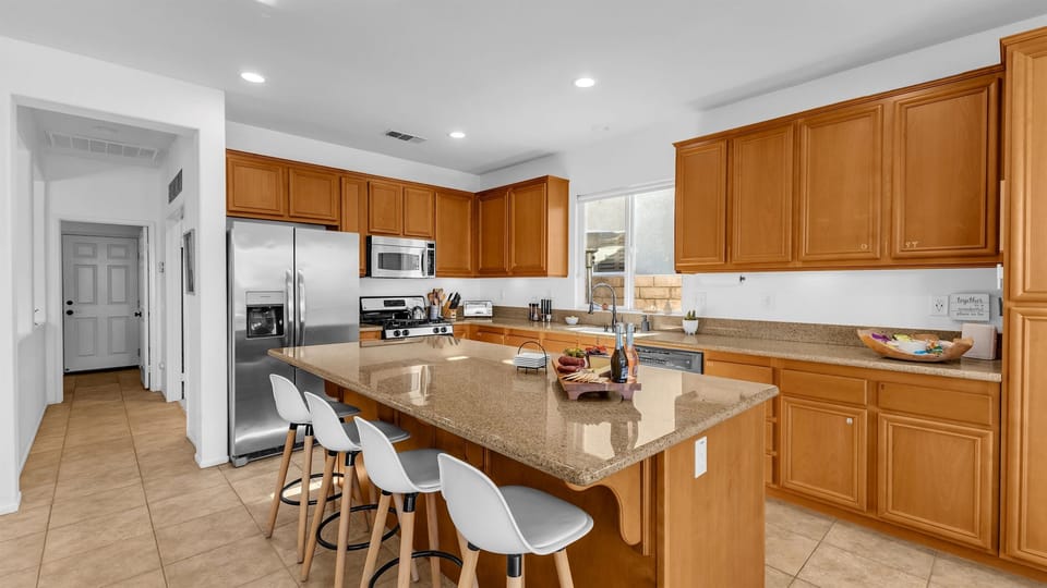 Fully equipped oversized kitchen with stainless steel appliances and ample counter space—perfect for cooking, entertaining, and enjoying great company.