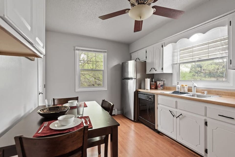 Kitchen View 3 - Full size refrigerator, double sink and cleaning supplies
