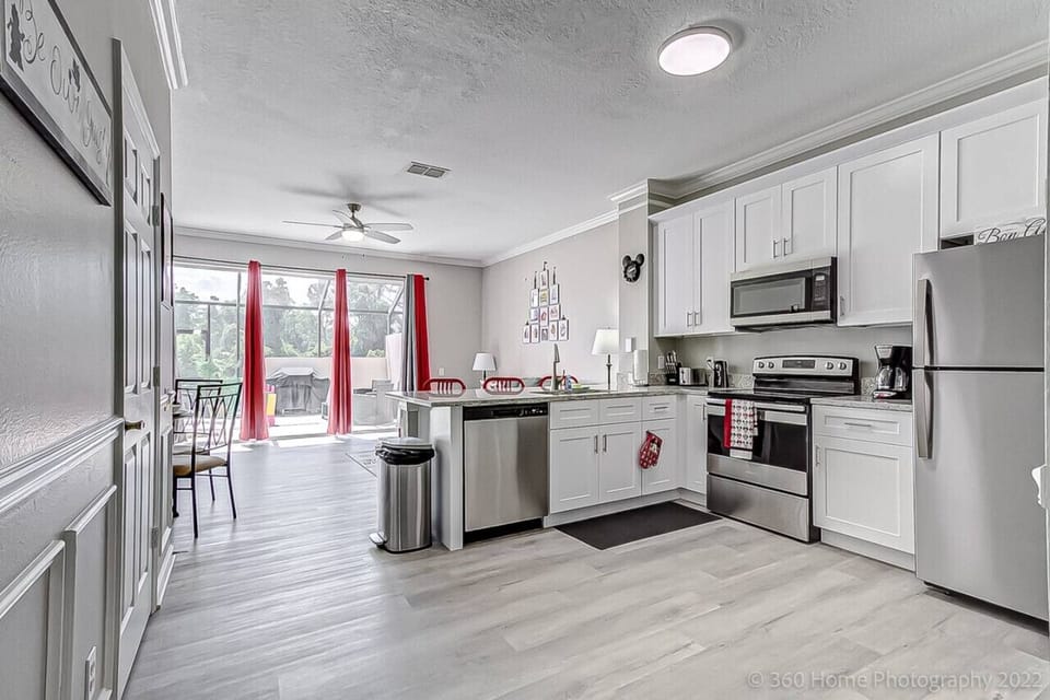 Seamless open-concept space combining kitchen, dining, and living areas for effortless living.