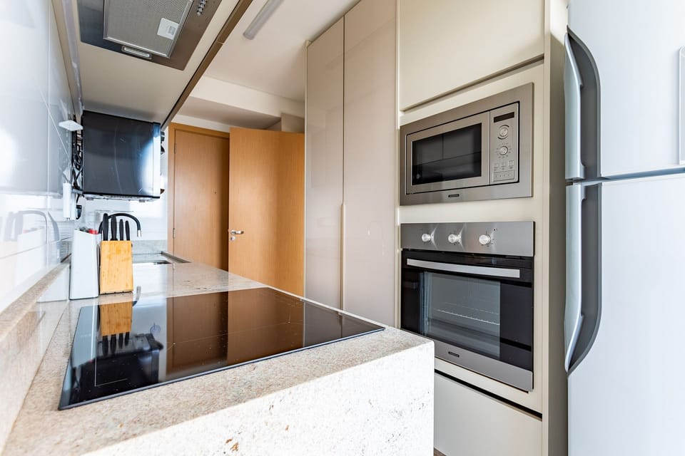 Deluxe Apartment | Private kitchen | Full-size fridge, microwave, espresso maker, blender