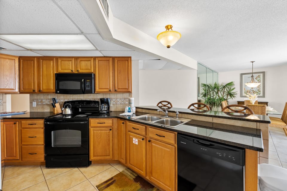 Fully Stocked Kitchen with Bar Seating