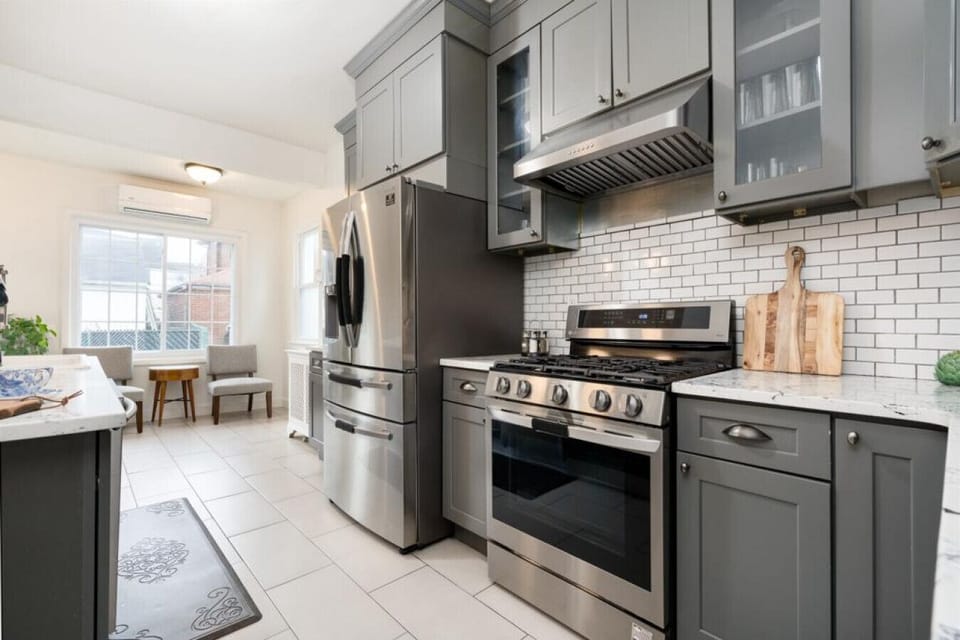 Experience culinary luxury in our newly renovated kitchen featuring long, elegant cabinets and fully stocked with state-of-the-art stainless steel appliances.
