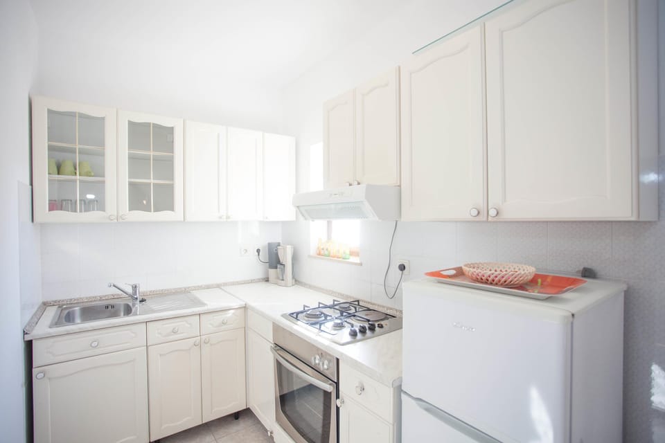Apartment, 2 Bedrooms | Private kitchen | Coffee/tea maker, electric kettle