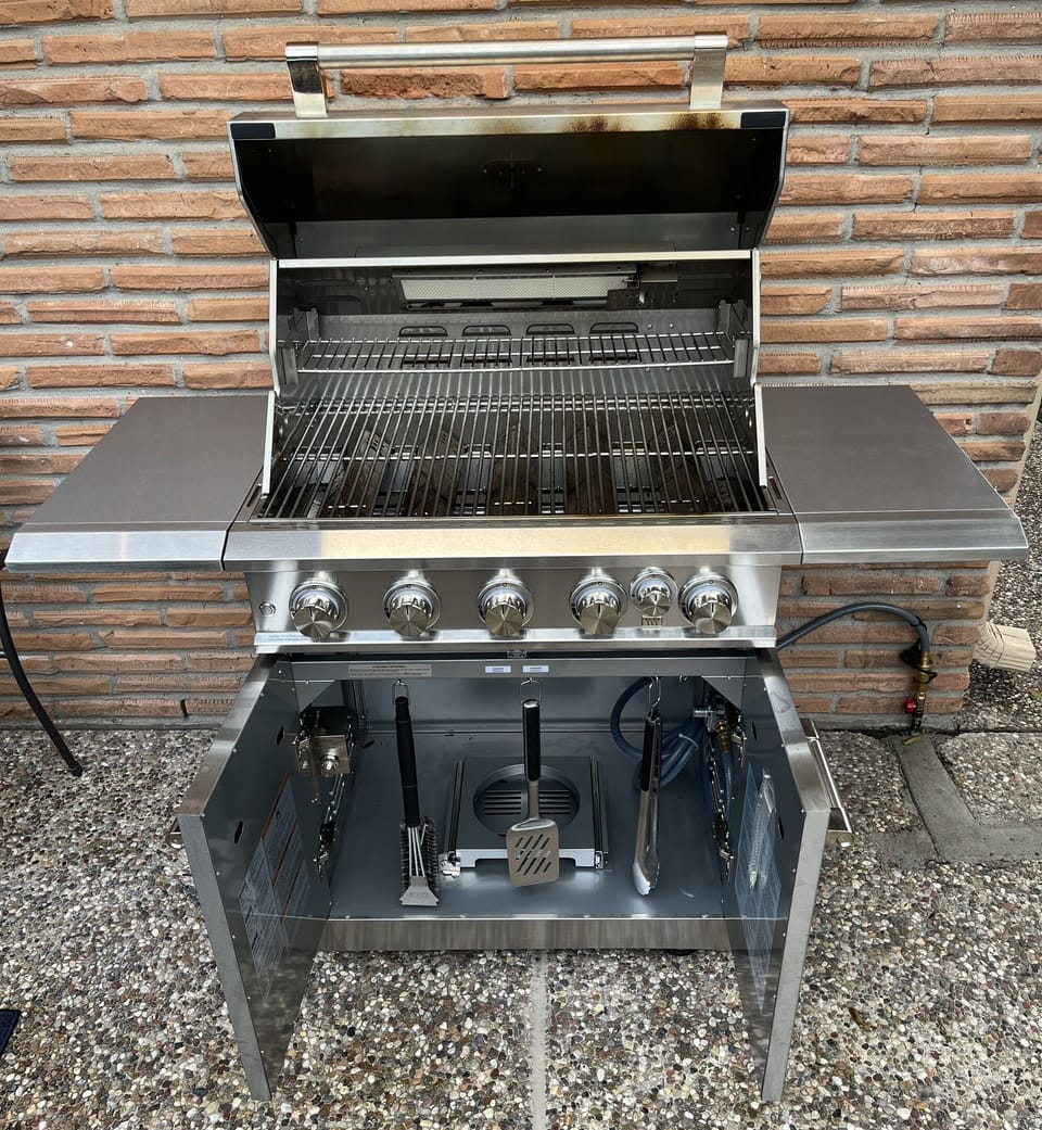High-end BBQ grill with tools you need for a backyard cookout 