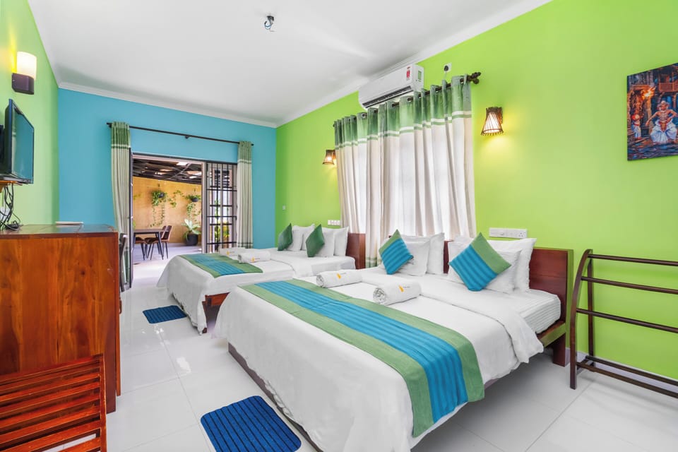 Deluxe Quadruple Room | Premium bedding, desk, laptop workspace, WiFi (free)