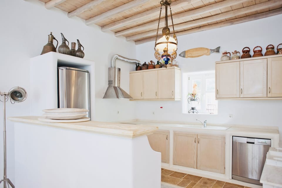 Villa | Private kitchen | Full-size fridge, dishwasher, electric kettle, cookware/dishes/utensils