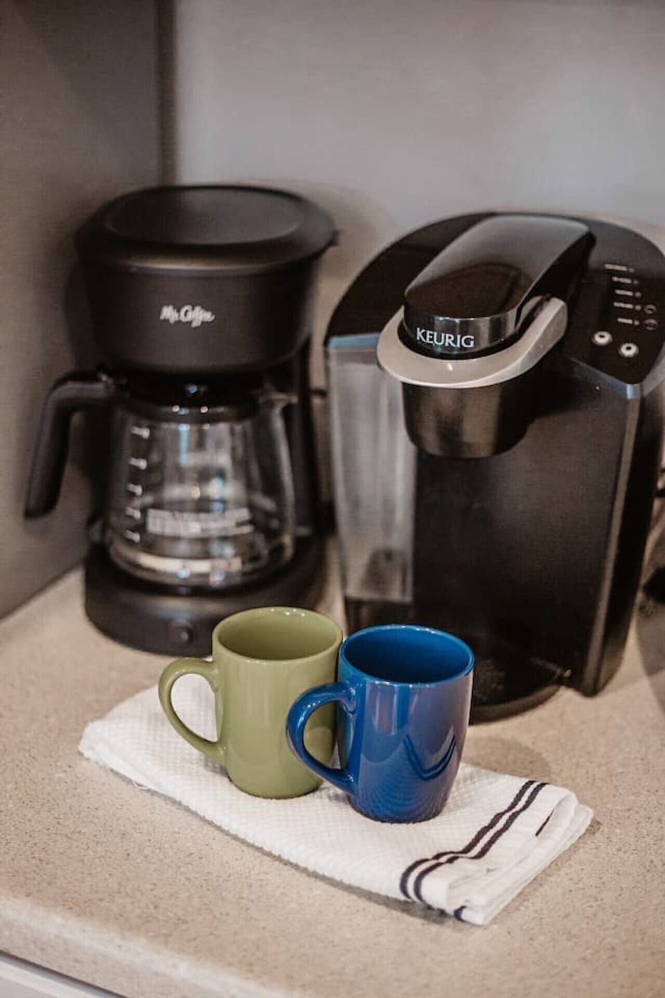 Drip coffee maker and Keurig machine. We provide coffee grounds, creamer and sugar. Bring your favorite K-cup flavor if you prefer!