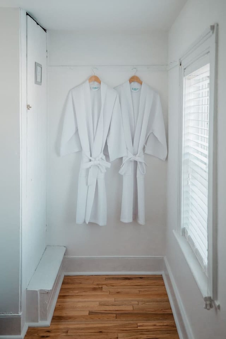 Front bedroom features a walk-in closet with complimentary bathrobes for added comfort.