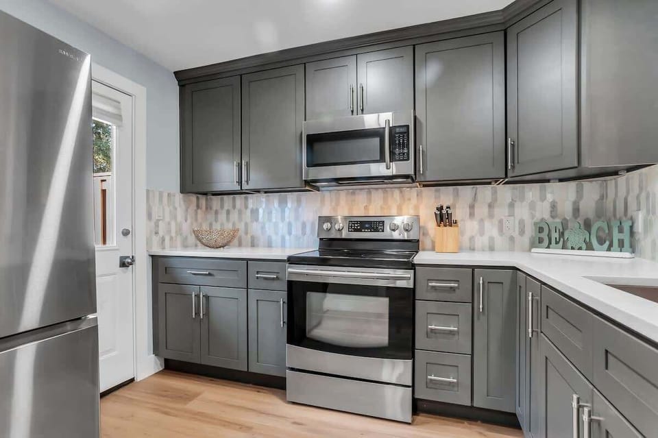 Your fully equipped kitchen features stainless steel appliances and ample cabinet space for preparing memorable meals during your stay.