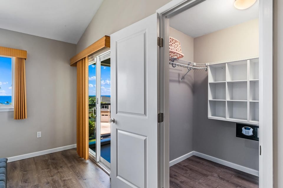 Primary walk in closet with safe
