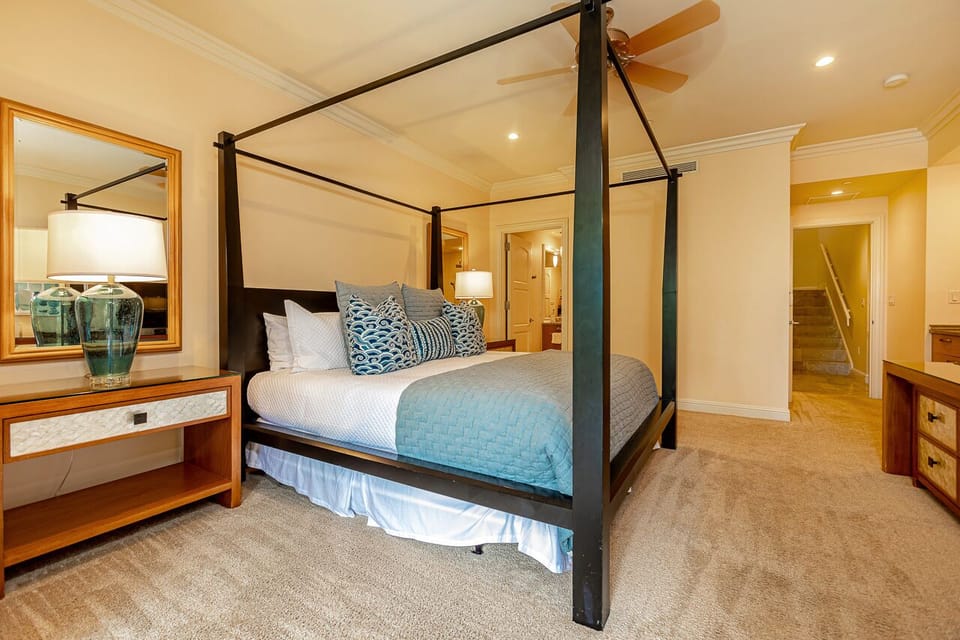 Downstairs primary bedroom features a king canopy bed!
