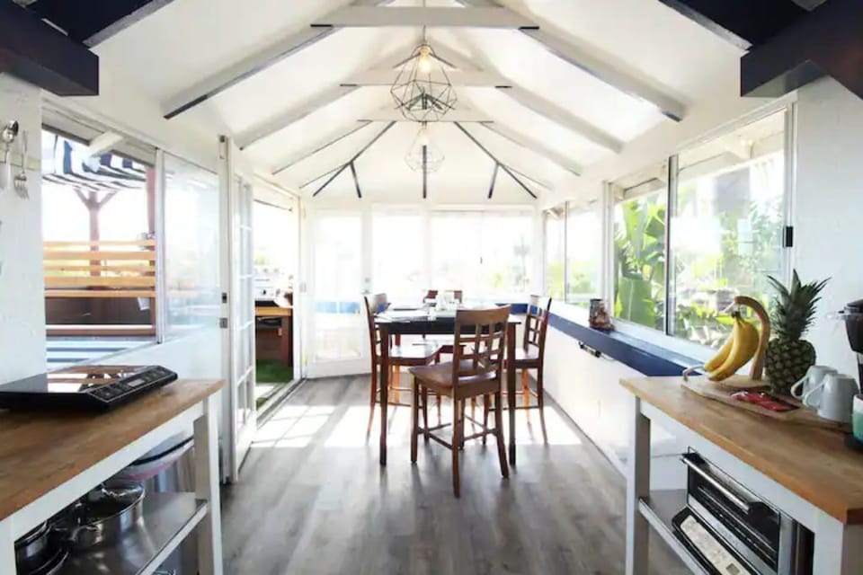 Upstairs kitchenette and sunroom.