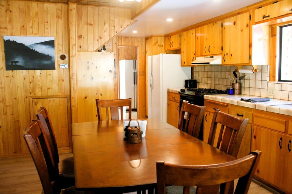 Dining table adjoins kitchen. Downstairs bath across hall from the refrigerator