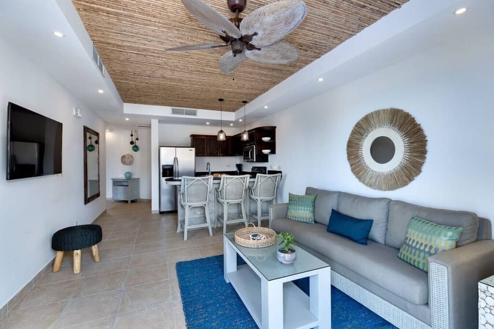 Open concept living area with breakfast bar.