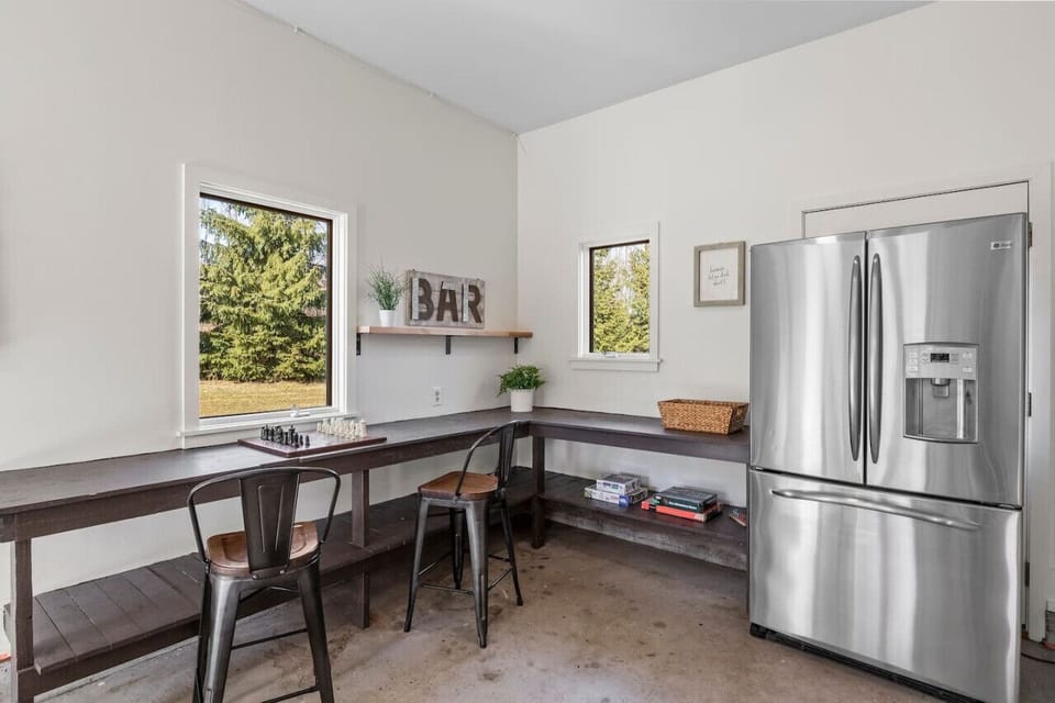 Additional fridge and chess/gaming area in game room