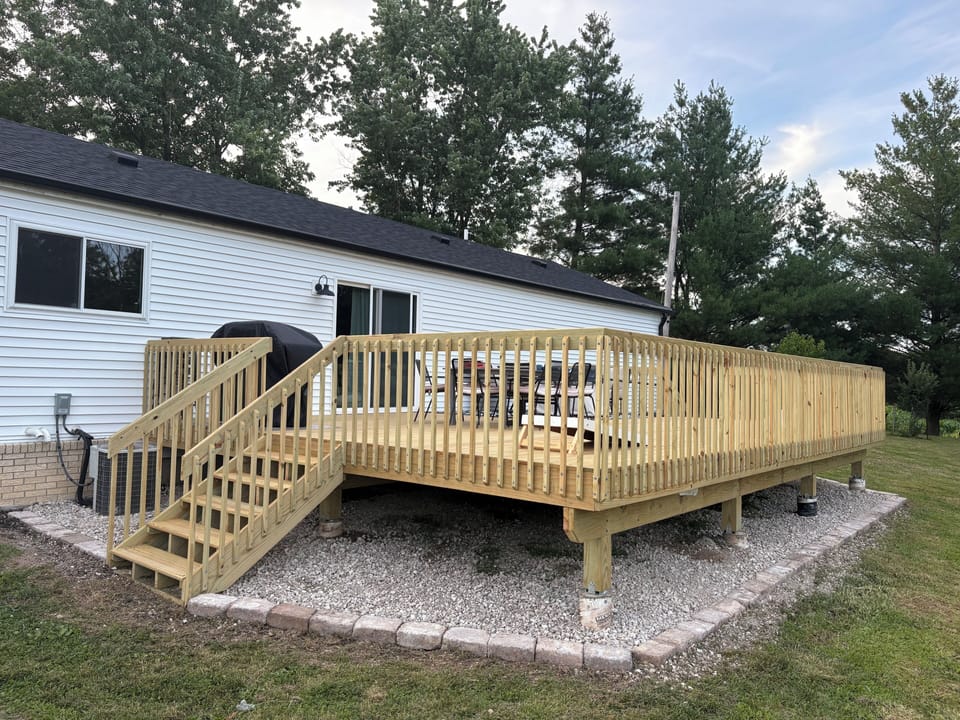 Huge deck with propane gas grill & fire pit. Dining table & sitting area. 