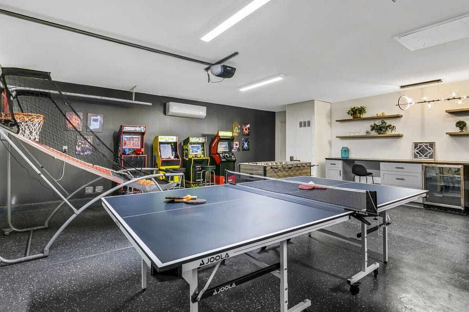 Garage game zone featuring ping pong & arcade-style fun