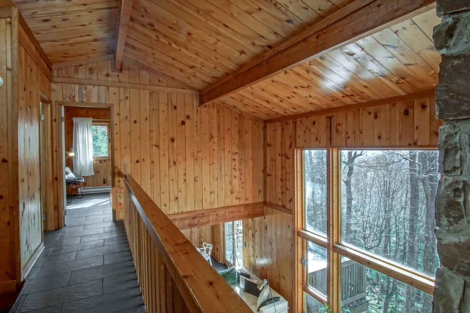 You can overlook the ground level from the 2nd level and see out the large windows!