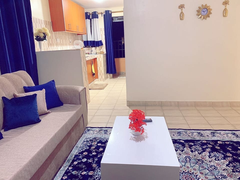 Business Apartment | Living area | 24-inch Smart TV with digital channels