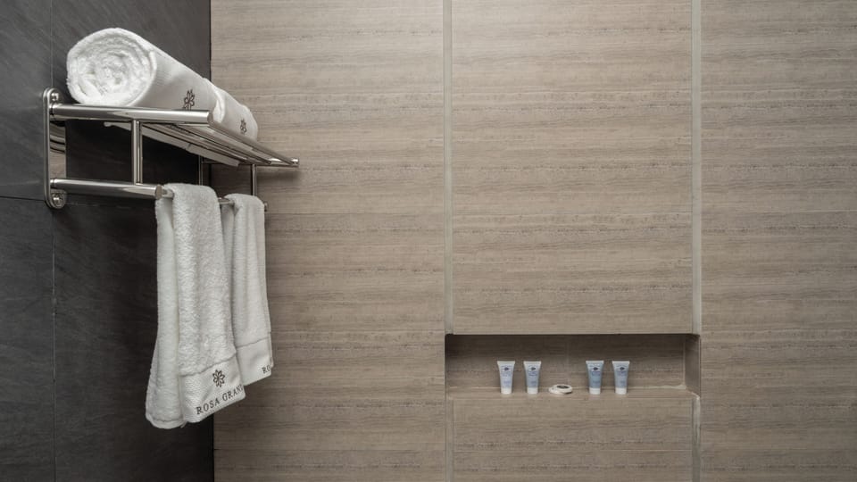 Separate tub and shower, rainfall showerhead, free toiletries