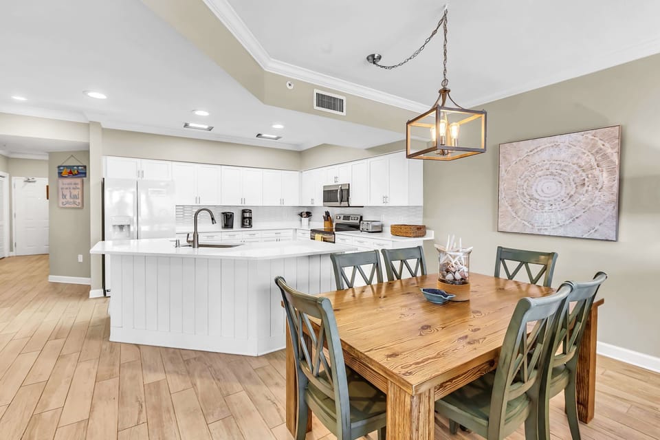 Coastal elegance meets relaxed dining in this inviting space.