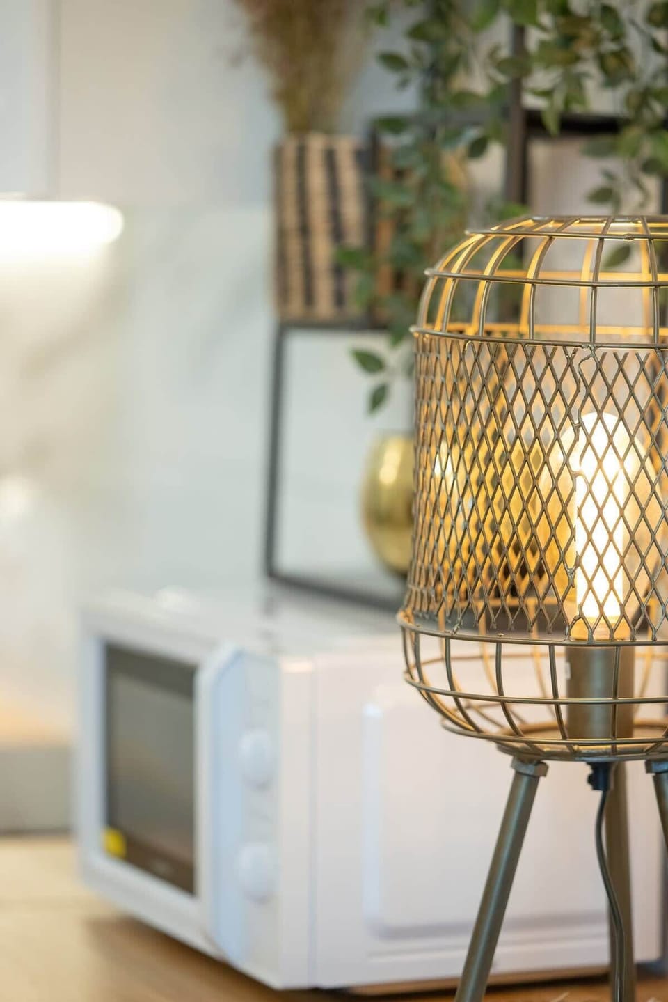 A decorative lantern placed on a side table, adding a cozy ambiance.
