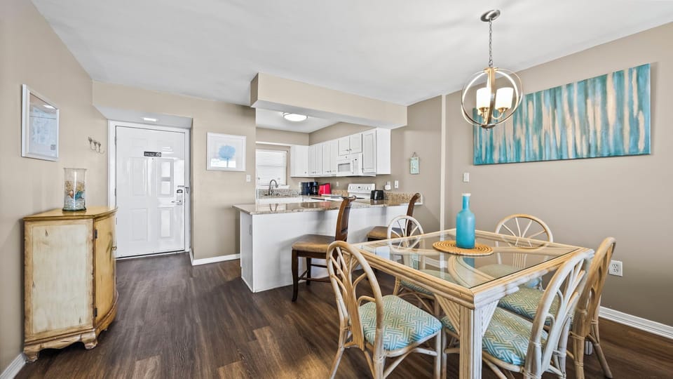 Seaside Beach & Racquet Club 5517 - Dining area with a table for five, conveniently next to a breakfast bar with seating for two.