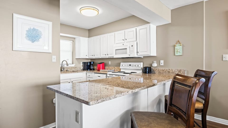 Seaside Beach & Racquet Club 5517 - Kitchen area with breakfast bar