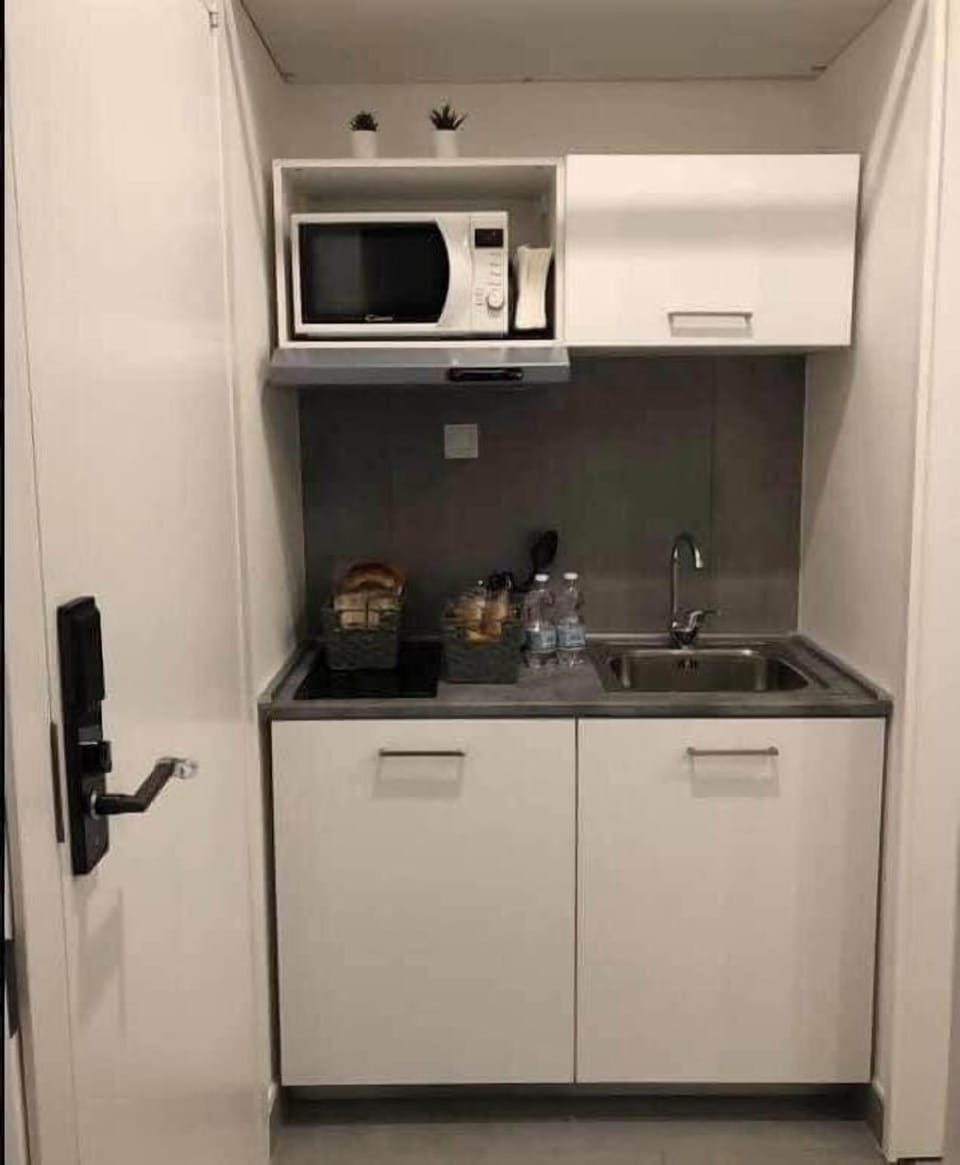 Business Triple Room, 1 Queen Bed, Non Smoking, City View | Private kitchen | Full-size fridge, microwave, stovetop, espresso maker