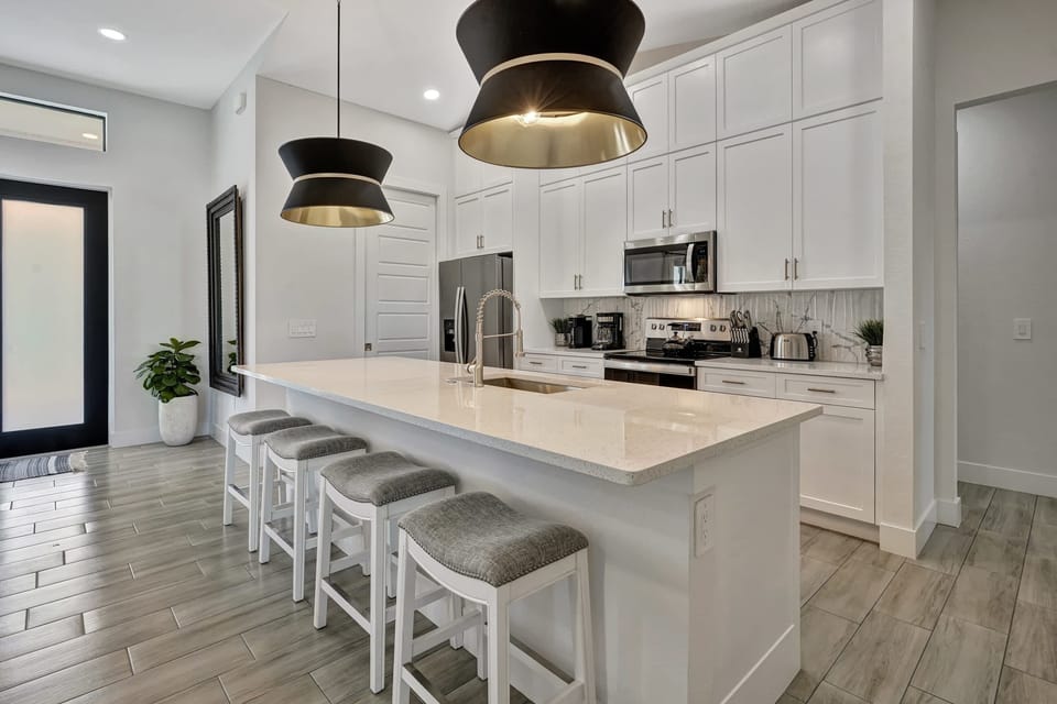 The kitchen has designer lighting
