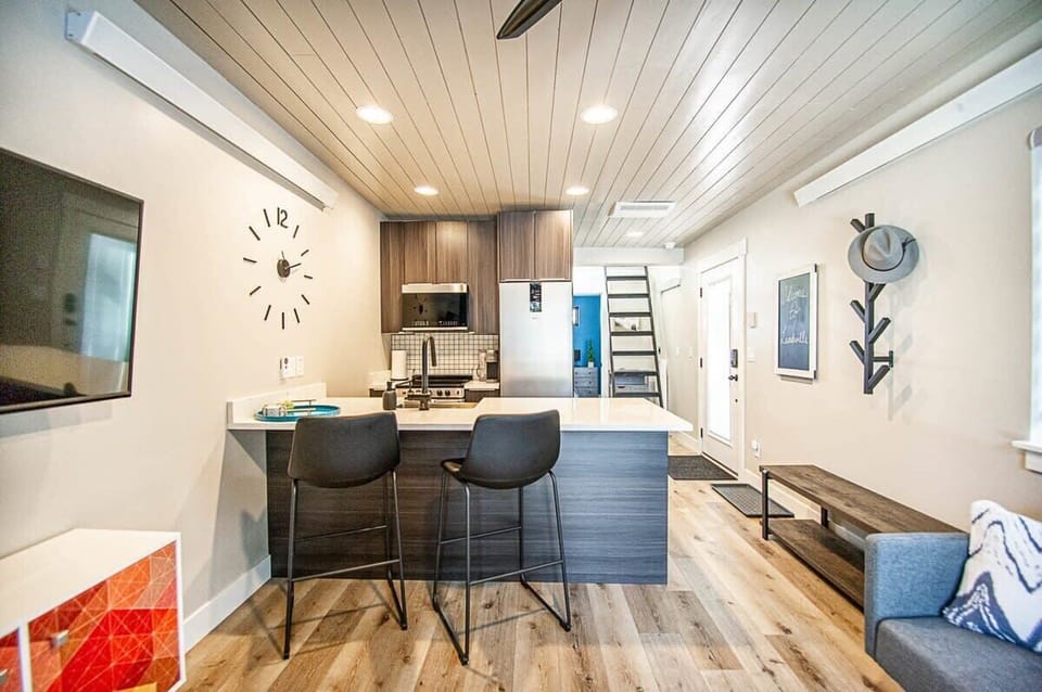 【Interior View】New-build layout — kitchen, living, loft ladder access, and entry in one 360-degree frame.