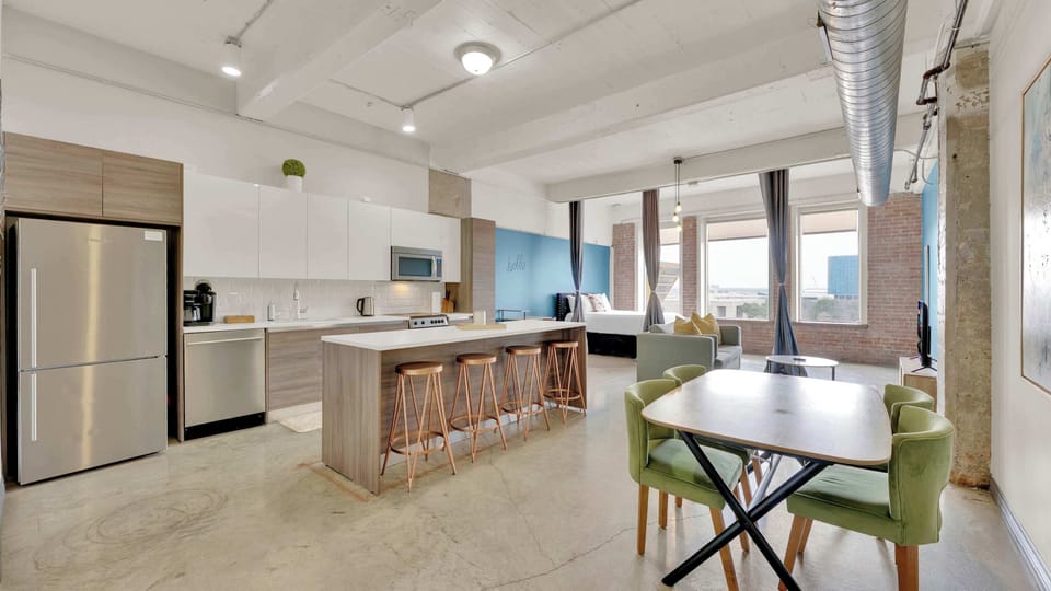 Modern Loft Kitchen: Stylish space with sleek appliances and inviting views for culinary adventures!