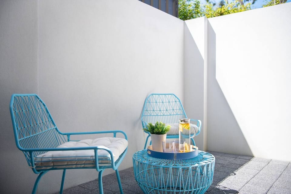 Outdoor seating nook—great for morning coffee or fresh air.