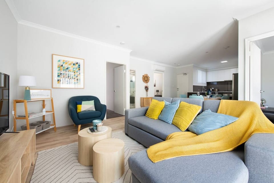 Stylish and spacious lounge area with vibrant decor touches.