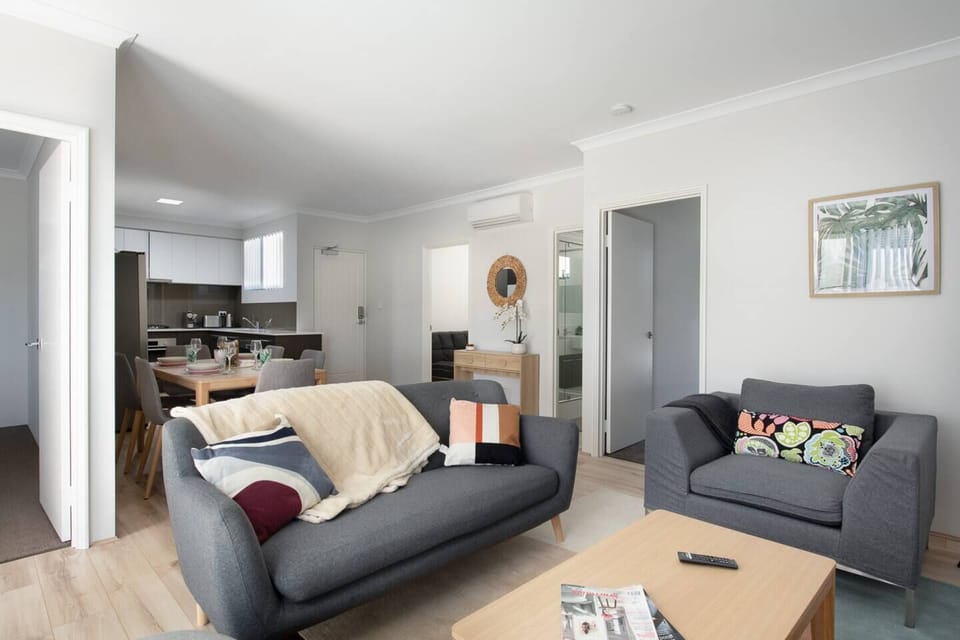 Relax and unwind in our open-plan living area, seamlessly connecting to the dining and kitchen space. 