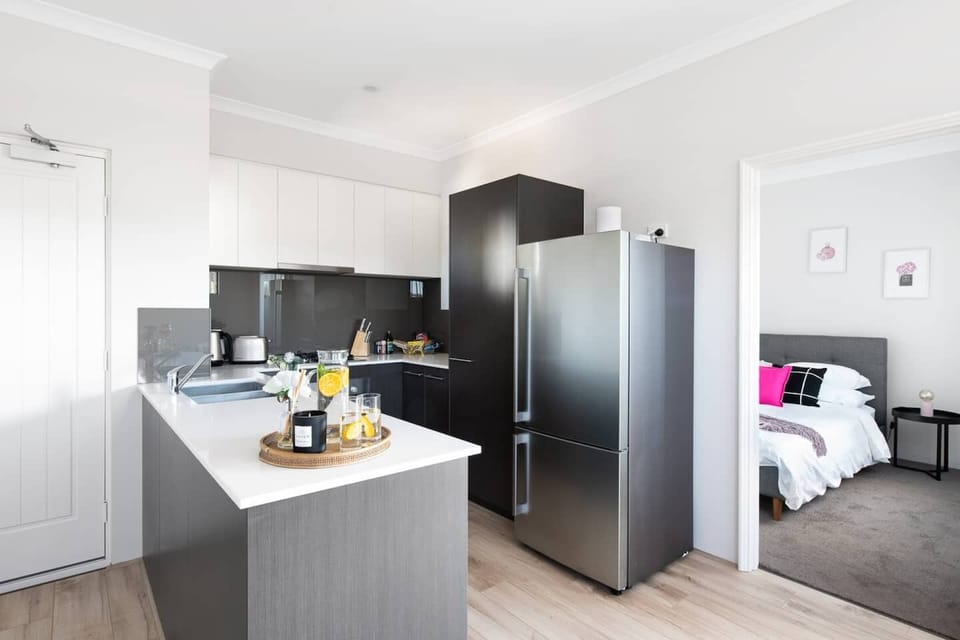Sleek and functional, this modern kitchen makes meal preparation a pleasure, whether you're cooking up a feast or just enjoying a snack.
