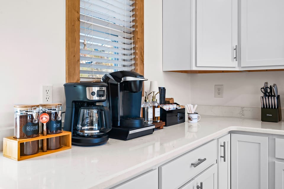 Coffee Bar with drip and Keurig machines, creamers and sugar