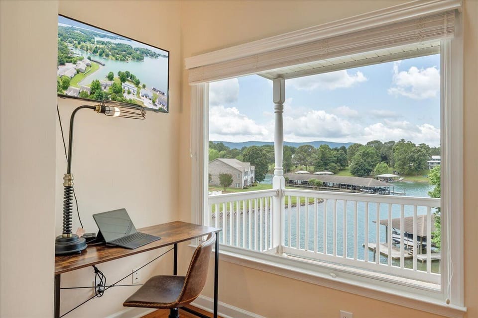 Work with a view! This third-floor office features a desk, chair, and stunning lake views for the perfect blend of productivity and tranquility.