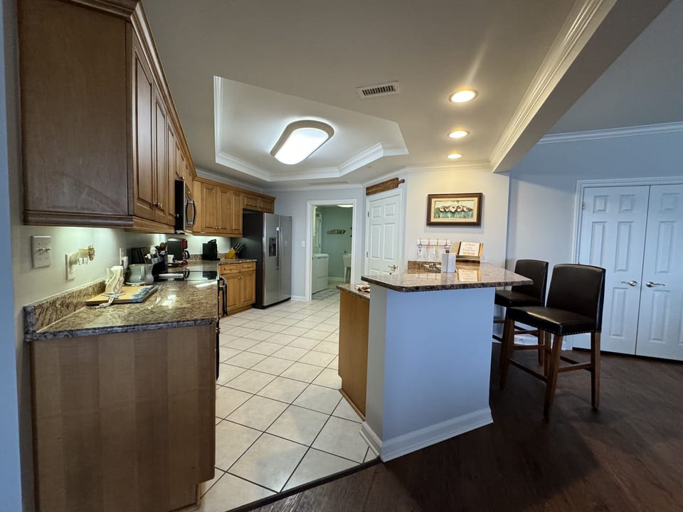 Full kitchen with additional island seating.