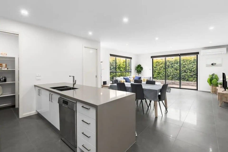 Light-filled open plan living, dining and kitchen space.