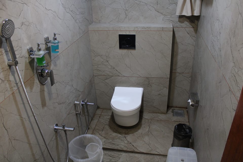 Shower, rainfall showerhead, hair dryer (on request), towels