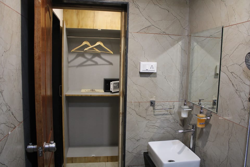 Shower, rainfall showerhead, hair dryer (on request), towels