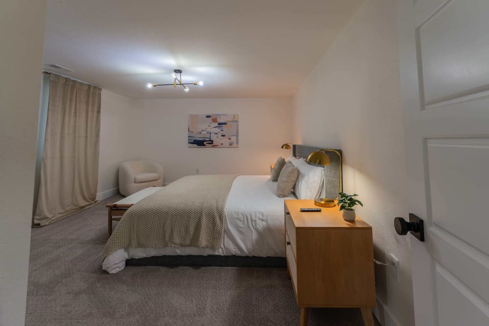 This spacious bedroom has a closet and window for light.