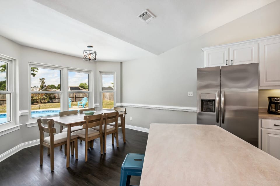 Eat in kitchen with views of the backyard and pool