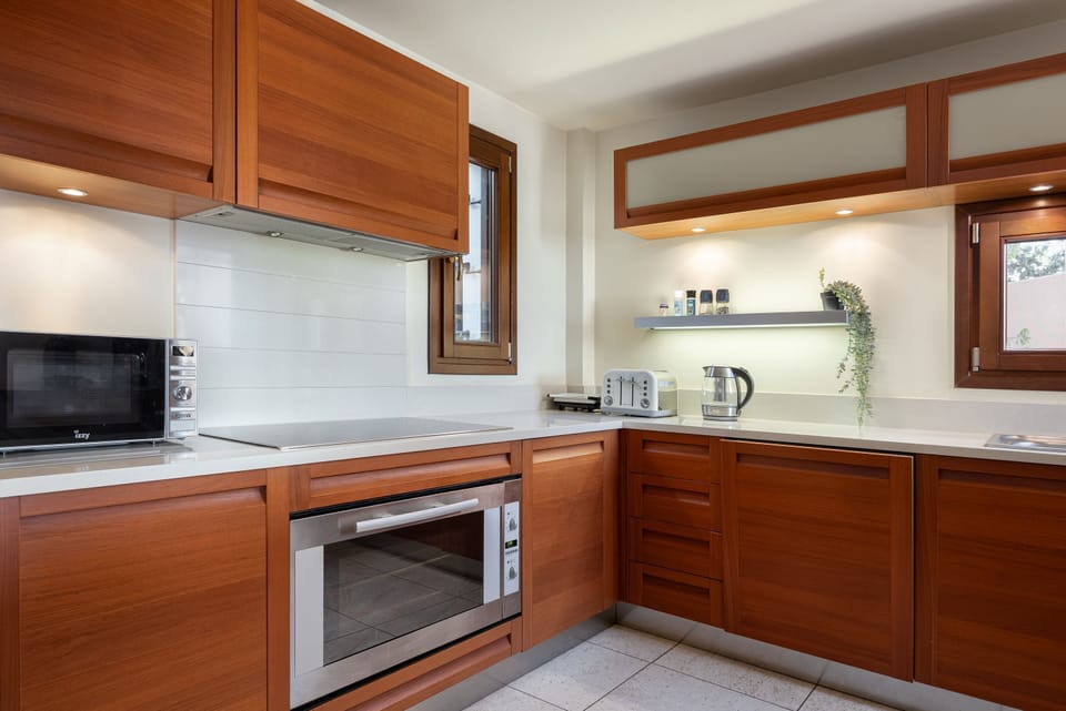 Luxury Villa | Private kitchen | Full-size fridge, microwave, oven, stovetop