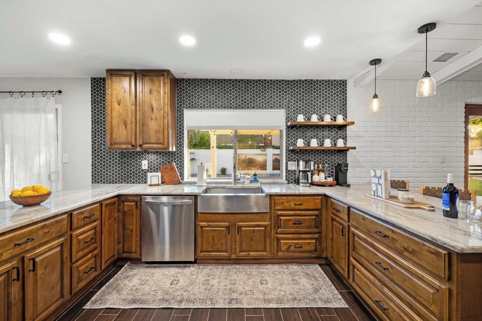 Stylish and functional kitchen with rich wooden cabinets and modern amenities.