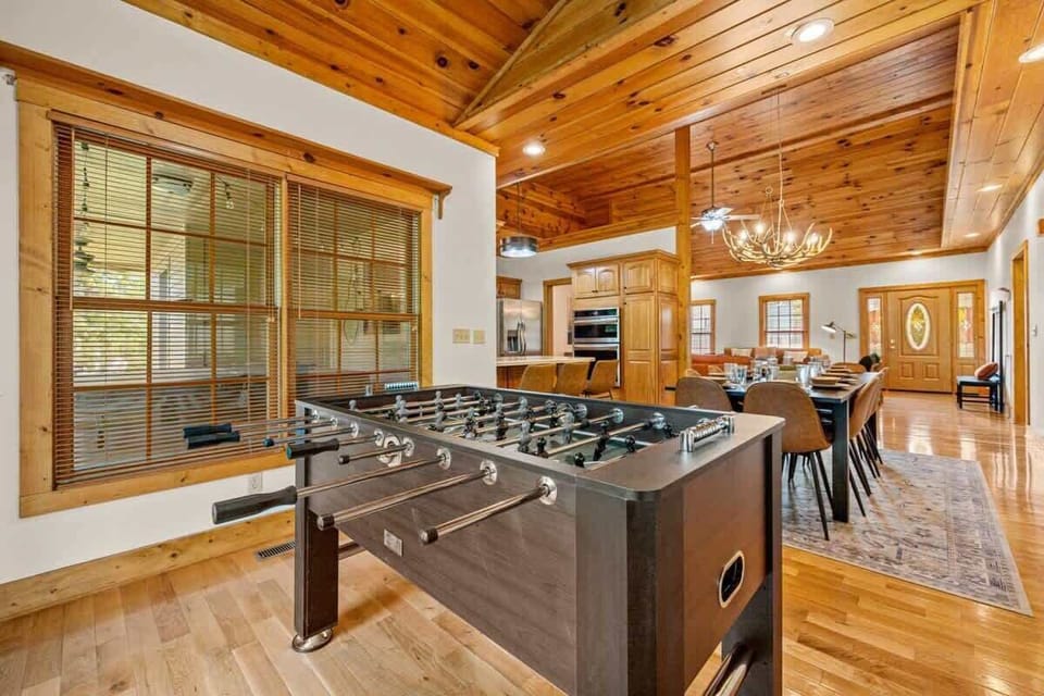 (Main House) Your Game Room! Dive into fun with foosball and stunning wooden beams overhead!
