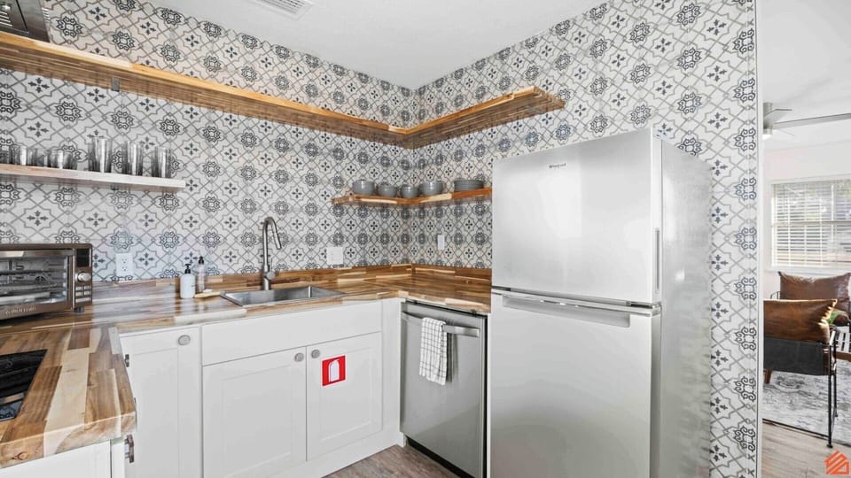 Fully equipped with modern appliances and plenty of counter space.
